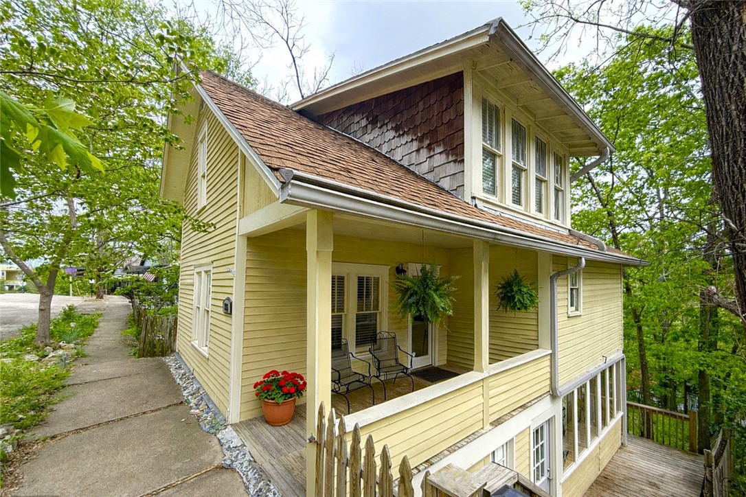You'll enjoy the vintage charm and modern amenities of this 2BR/2.5BA remodeled Spring Street cottage originally built in 1890. The main level features an open floor plan with a spacious living room, kitchen, dining, and a powder room. The kitchen has beautiful quartz counters, custom cabinets, a gas range, a pot-filler faucet, an undercounter ice maker, and a tile-and-beadboard backsplash. French doors open onto a back deck perfect for outdoor entertaining, with a wonderful view of East Mountain. The lower and top levels have large private ensuite bedrooms with sitting areas, and baths with glass and tiled walk-in showers. The lower-level bedroom also has a jetted soaking tub and a private back deck. The property includes a vacant lot where you could build a garage or a parking pad. You'll enjoy the level, easy walk to Spring Street shopping and dining, and the fact that it's just a few steps from the Carnegie Library, Crescent Park, and Spring Garden walking trails. Residential only, nightly rentals not allowed.