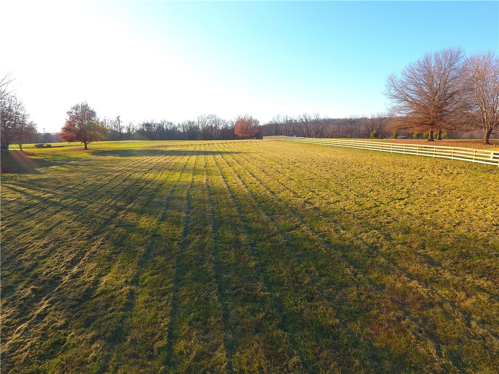 Here's your chance to own a beautiful 5.35-acre tract in eastern Washington County, located at 929 Tuttle Rd in Elkins, AR. The property features a wide, flat stretch of open ground—perfect for building your home, shop, or small homestead. The land lays exceptionally well, offering plenty of flexibility for layout and use, with mature trees adding natural privacy and character. Set in a quiet, well-kept country neighborhood, it provides peaceful rural living while still being less than 20 minutes from both Fayetteville and Springdale. Electric is already on the property, and a well and septic will be needed. Level, buildable acreage in this area is getting harder to find, and this property stands out for its usability, setting, and convenience. A great opportunity you won’t want to miss.
