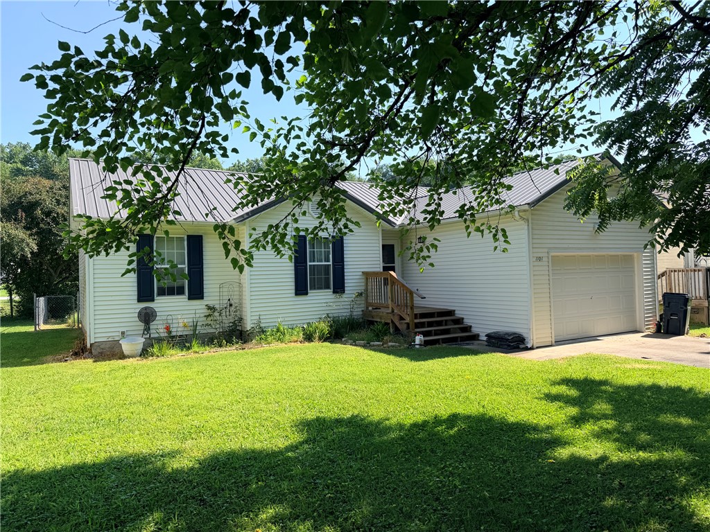 This charming 3-bd, 1-1/2 ba home near downtown offers the perfect blend of modern upgrades & exceptional outdoor space. Situated on a landscaped, level lot within a desirable neighborhood, the property features a fully fenced-in backyard with a unique bonus—the actual property line extends 3' beyond the fence on all three sides. Peace of mind comes standard with an exterior security system featuring cameras in 3 locations, complete with a subscription fully paid through Jan 2027. The home has been meticulously maintained with an impressive list of recent capital improvements. Exterior upgrades include a new roof on home & storage bldg in 2025, & new front and back decks perfect for outdoor entertaining. Inside, you will find a collection of updated appliances & mechanicals, including a 2026 dryer, a 2024 dishwasher and water heater, and a 2023 garage door & automatic opener. New heat pump in 2017 & new motor 2025. This move-in-ready gem combines downtown convenience with worry-free living for years to come.
