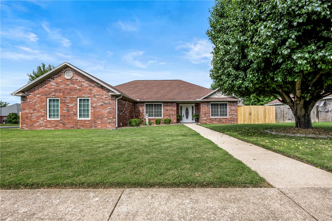 This all brick home's recent improvements include new Anderson windows, HVAC system, water heater and new roof for your peace of mind. This home features multiple living areas and a Formal Dining Room that could be converted into another bedroom, hobby room or home office. The sunroom provides the perfect place to relax and creates an additional gathering area for family and guests. The eat-in kitchen has solid wood cabinets, stainless steel appliances including the refrigerator and double oven range hood. The primary suite offers private comfort, while two additional bedrooms provide flexibility for family, guests, or workspace needs. Step outside to enjoy the large, fully wood privacy fenced backyard featuring 2 new gates on each side of the home along with a lush lawn and concrete patio perfect for outdoor dining and entertaining. Conveniently located in the heart of Pea Ridge with easy access to schools, parks, and Northwest Arkansas amenities, this move-in-ready home combines comfort, quality, and value.