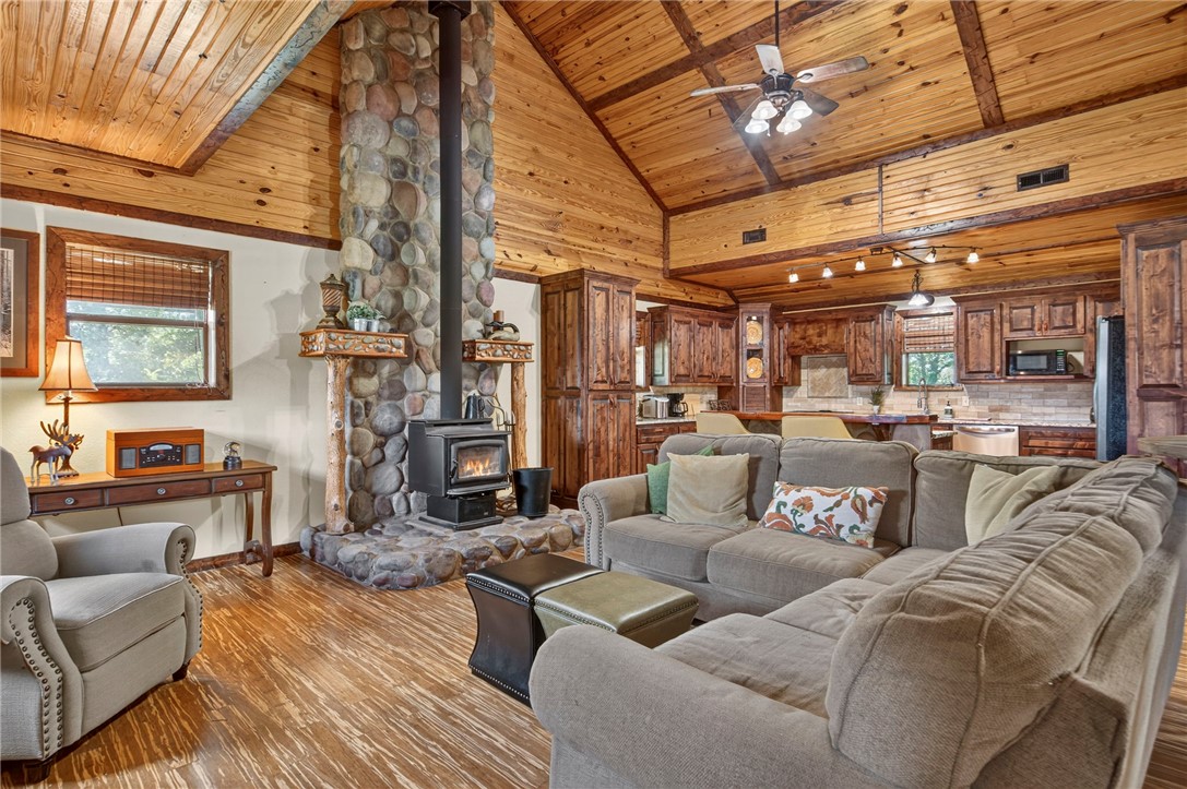 Escape to your own secluded cabin retreat on 5 picturesque acres, where rustic charm meets modern comfort. This 3-bedroom, 2-bath cabin is the perfect weekend getaway, cozy winter escape, or income-producing Airbnb. Guests will love gathering in the inviting living spaces, relaxing in the upstairs loft leading to the third bedroom, and unwinding after a day of adventure. Fresh paint, newer carpet, custom cabinetry, spacious walk-in closets, plus a like-new HVAC system and septic tank make this cabin move-in ready. Outside, the 30x60 shop offers endless space for outdoor gear, recreational vehicles, hobbies, or additional storage. Tucked away in a peaceful setting yet just minutes from Bella Vista's renowned walking and biking trails and approximately 15 minutes from the Walmart Home Office, this property offers the perfect balance of privacy, convenience, and adventure. Whether you're looking to create unforgettable guest experiences or your own personal retreat, this cabin is ready to make memories year-round.