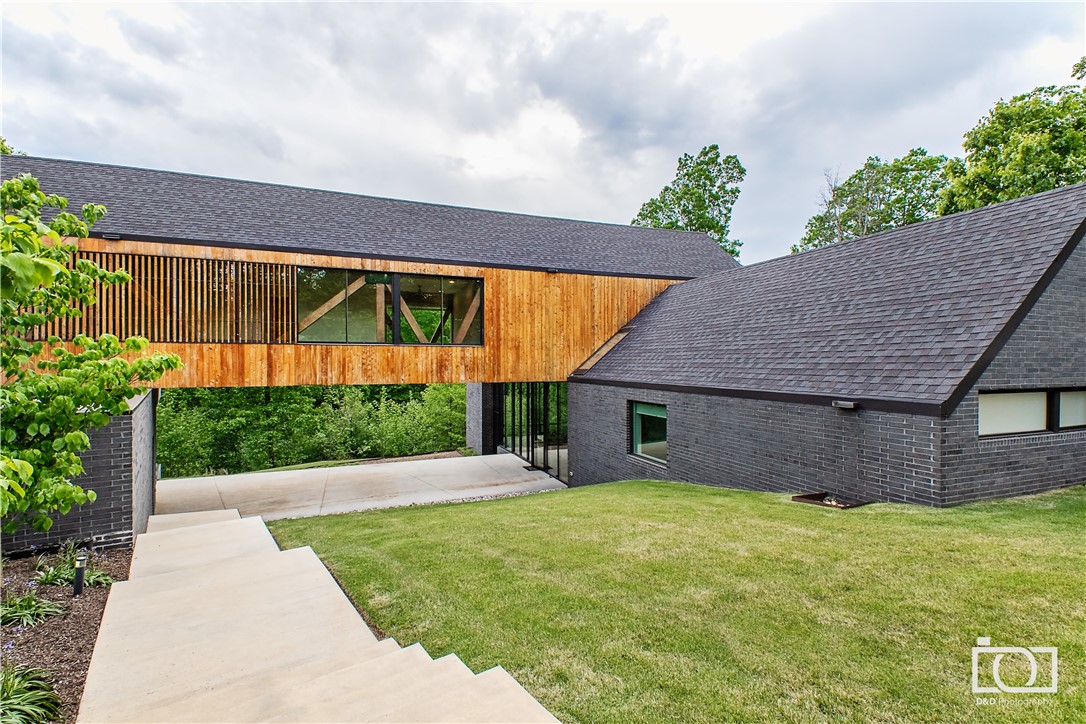 Award Winning home designed by Modus; featured in Citiscapes Magazine is an entertainers dream!
Modern home with beautiful landscaping, private wooded setting, and exquisite architecture! This
property features 1.48 acres, custom automatic shades, ample natural light, white oak flooring, smart light
switches, custom accordion door, LED bridge lights that extend from kitchen, black leather granite.
multiple wifi nodes, dog wash station, foam insulation, and much more! Check out VIRTUAL TOUR!
