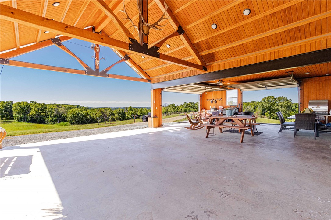 Discover this rare legacy 129 ac m/l retreat with 360° views of Boat Mtn and Crooked Creek. This estate features a 2,458 sf main home (remodeled 2016, new metal roof 2022) with granite counters, stainless appliances, & a concrete storm shelter. A secondary 980 sf farmhouse offers turnkey VRBO potential. Outdoor living shines with a massive pavilion that houses a carport & outdoor kitchen area built with steel I-beams, recessed lighting & garage doors. For the hobbyist, a 30x46Quonset Hut includes 220V power, concrete floors with drains, & pull-through doors. Additional structures include a dairy barn converted to a chicken coop & a"Hillbilly Shooting Shed." The land is a paradise: 36 ac m/l of pasture, 89 wooded ac m/l, & a perimeter ATV road. Enjoy a stocked, aerated pond and 40 fruit trees(Granny Smith, Georgia Peaches, Ruston Red Peaches, Arkansas White Peaches, Pears, and Persimmons too!). This is an ultimate property designed for luxury,utility, and self-sufficiency.