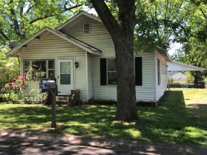 Test your 'fixin' skills to have a nice affordable cottage to live in or for rental investment. Sunroom does NOT have a closet but is being counted as 3rd bedroom. Detached carport, storage and laundry. Fenced back yard. Being sold as is so buyer to inspect to their satisfaction. NOTE;There is a 10-day waiting period before seller will consider offers. beginning on 5th.