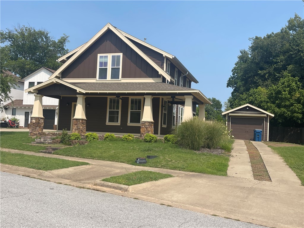 DOWNTOWN BENTONVILLE district has this lovely craftsman style 4 bedroom. 3.5 bath home available for lease. Great location in the Downtown Bentonville District just off Central. Only blocks to the downtown square, or The Momentary and only blocks from the new Wal-Mart Campus.  This beautiful home features covered front porch with ceiling fans, bamboo floors, granite countertops, stainless steel appliances in the kitchen, covered rear patio, fenced backyard and 1 car detached garage. Refrigerator, washer and dryer are provided for tenant use.
