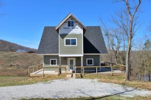 How close do you want to be to Table Rock Lake, how bout 100 feet? That's what you get with this well built unfinished home that you can finish out with all your own touches. Unbelievable views off the wrap around porch! All the hard stuffs already been done!