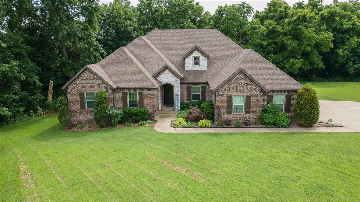 Welcome to your own private retreat in the highly sought-after Knolls subdivision! Perfectly maintained and move-in ready, this beautiful home sits on a pristine 2.27-acre wooded lot with peaceful forest views and exceptional privacy. Enjoy morning coffee on the spacious back deck or unwind in the screened porch while taking in the tranquility of nature. Inside, you'll find quality craftsmanship throughout, including custom cabinetry, gleaming granite counters, high-end appliances, central vacuum, and a security system for added convenience and peace of mind. The thoughtful floor plan offers both a formal dining room and a sunny eat-in kitchen, making entertaining effortless. Residents of The Knolls enjoy outstanding community amenities including a swimming pool, clubhouse, tennis courts, and pickle ball. If you've been searching for a luxury home with acreage, privacy, neighborhood amenities, and easy access to modern conveniences, this exceptional property is one you won't want to miss.
