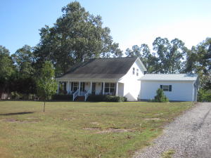What a beautiful setting!  Come enjoy this 4 bedroom 2 bath home in a very quiet location.  In the evenings, sit on either you front or your back covered porch and enjoy what nature has to offer.The home is very energy efficient and also offers beautiful hardwood floors, large master bath, outbuildings and plenty of room for peace and quiet.