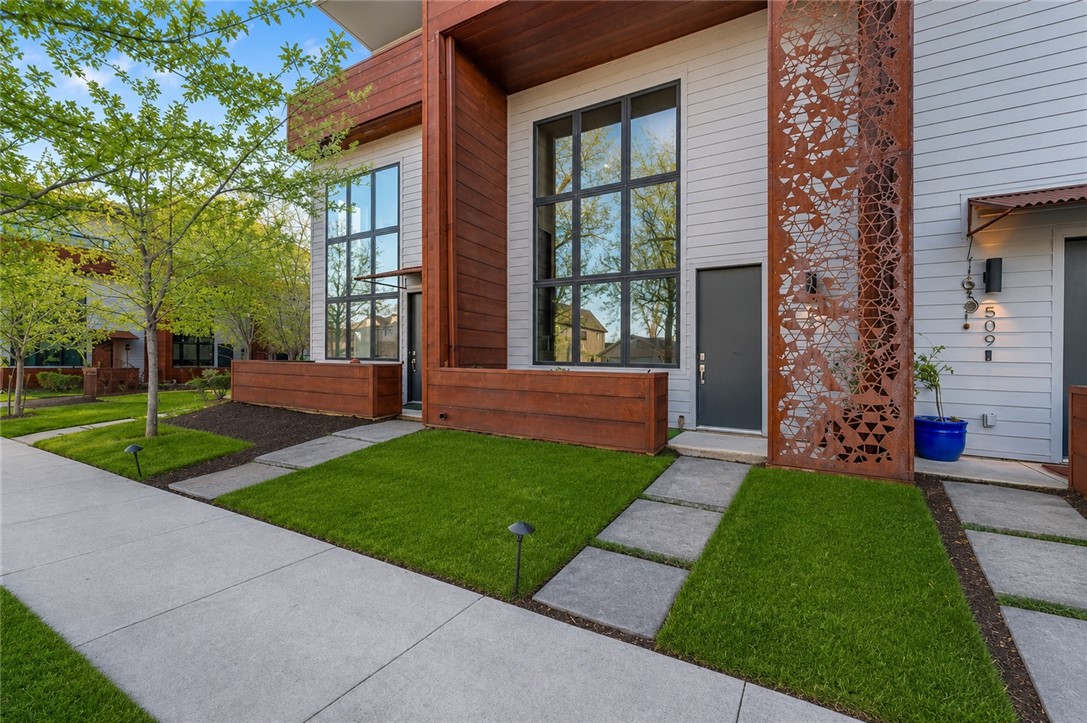 Modern urban living in the heart of Bentonville! This architecturally distinctive townhome blends luxury, convenience, and investment potential in one of Northwest Arkansas’ most desirable locations. Featuring soaring ceilings, abundant natural light, warm hardwood floors, and an open-concept layout, the home feels spacious and inviting. Designer finishes, flexible living spaces, and low-maintenance living offer the perfect mix of style and functionality. Located minutes from Downtown Bentonville, the Bentonville Square, Crystal Bridges Museum of American Art, The Momentary, Walmart Home Office, world-class bike trails, shopping, dining, and parks. Complete with 2 assigned carport spaces and lock-and-leave convenience, ideal as a primary residence, second home, Airbnb, or investment property!