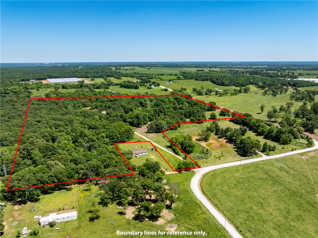 Discover the potential for a fresh start at 22212 W Big Springs RD, Gravette, Arkansas. This manufactured home offers a compact yet functional footprint of 2432 square feet along with a 1064 stick built addition, designed for comfortable living in a serene setting. This residence provides four well-proportioned bedrooms, offering versatile spaces for family, guests, or dedicated home offices. The two full bathrooms are thoughtfully integrated, ensuring convenience and privacy for all occupants. Embrace the opportunityto create your ideal living environment within this charming property. Inquire today to schedule your private viewing and envision the possibilities that await. Court ordered sale, requires court approval! Allow 72 hours on any offers!