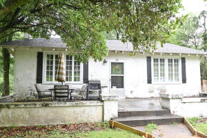 Charming and ADORABLE REMODELED home near downtown Morrilton! Residing on 2 city lots & with fenced in backyard. This charming home features newly renovated farmhouse inspired kitchen w/subway tile from counter to ceiling, butcher block countertop, stainless appliances, shaker style cabinets! Large dining room & living room with oversized windows to bring in natural light. Beautiful refinished original wood flooring throughout and 9ft ceilings. Nostalgic painted brick gas fireplace and built-ins & much more! NEW ROOF 1 year old, Heat and Air only 3 years old.