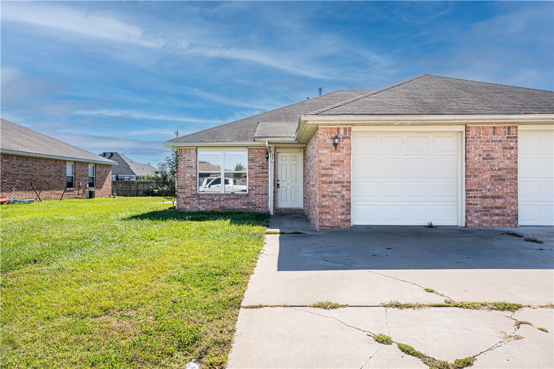 Nice 3 bedroom 2 bath duplex close to schools and 71 business. Plenty of room with open living room and kitchen, one car garage and a good size back yard. Refrigerator included. Pictures are similar but may not be exact. A couple duplexes are available.. Credit and Background check required