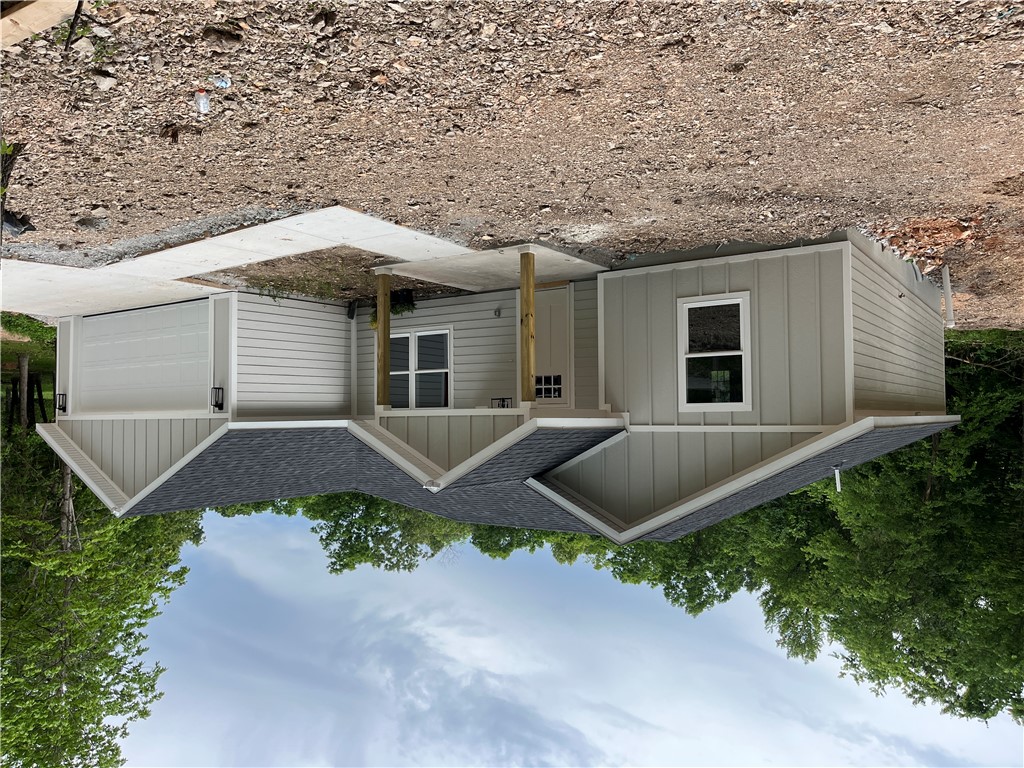 Beautiful 1600 square foot house on almost 2 acres with a split floor plan and no dirt road! Spacious walk in closets and an open design make for ease of living and comfort! Covered back porch and 2 car garage allow for space to enjoy and extra storage! Schedule your showing today!!