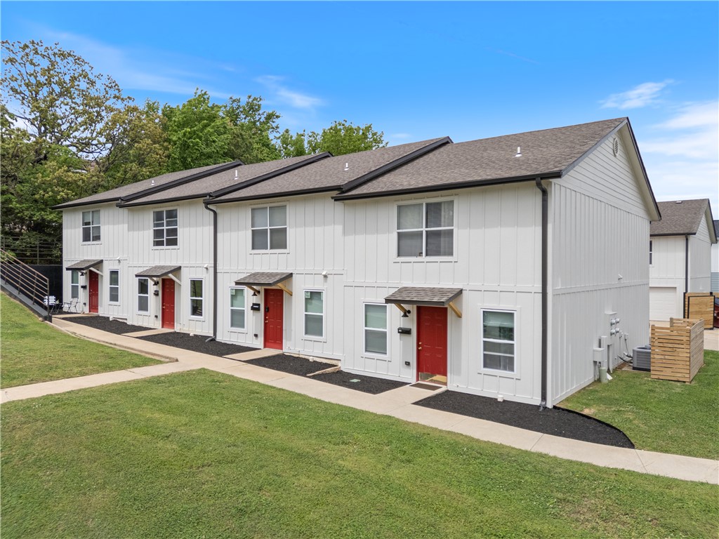 Rose Hill Townhomes consists of eight fully renovated, 100% preleased townhomes two blocks from campus. Units offer rare amenities for tenants in the area including attached two-car garages for each unit, full-size supplied washers and dryers, and superior walkability to U of A academic buildings as well as football and basketball venues, nearby retail, and the Razorback Greenway. Each unit features two large bedrooms and two full bathrooms as well as an extra half bathroom near the living area. Renovations include full exterior Hardie board siding, roofing upgrades, drainage and landscaping updates, several new HVAC and water heater systems, and new flooring, countertops, cabinets, stainless steel appliances, fixtures and bathroom upgrades in the interiors of the units. Units are leased at an effective monthly rent of $1925 per unit, with similar nearby townhomes (without garages) renting for $2400+, providing significant upside for buyers in future years.