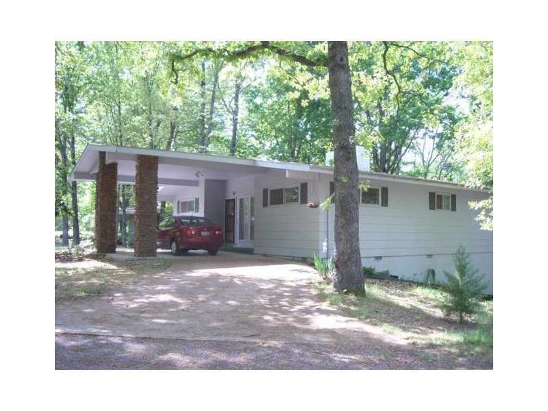 Ready to move in. All wood floors. Partially updated. Freshly painted interior.Vaulted ceilings and doublesided fireplace. Formal dining and breakfast bar. Open floor plan. Fenced back yard with deck all the way across back of house. Newly restored. Backs up to bike trails. Pets negotiable.