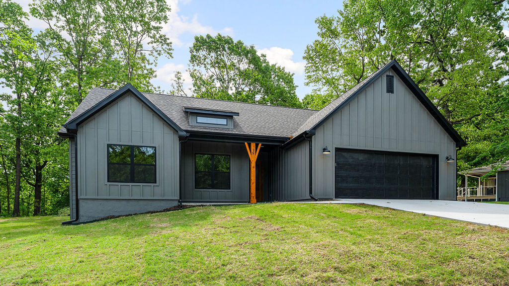Brand-new construction in Bella Vista with the kind of upgraded, custom-home-style finishes that sets it apart. Quality details are found throughout, including no carpet, a custom tiled shower, a spacious laundry room with a custom mud bench / storage space, spray foam insulation, and an oversized garage with room for additional workspace. The exterior features durable Hardie/masonry construction with no vinyl, adding to the home’s polished, high-quality feel. Enjoy a large covered patio with additional patio space overlooking a super-flat lot that is easy to maintain and enjoy the surrounding beauty of Bella Vista. Located near the Highlands exit on I-49, with quick access to Branchwood Recreation Center, paved walking trails, pickleball courts, indoor pool, Bella Vista trail systems, and all the amenities the area has to offer. Completed, upgraded, and ready for its first owner!