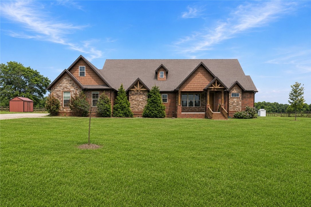 Don't miss this one of a kind property! Sitting on almost 7 acres, this property hosts so many different amenities. Your own pickleball court, pool, and treehouse just to name a few great features. The home itself has an open floor plan with granite countertops, upgraded kitchen appliances, and custom built-ins. It has a split floor plan with two bedrooms on the main floor and two upstairs. New stalls were just added in the barn. The tiny home out front makes a perfect in-law's quarters! This property is perfect for all of your hobby farm desires, or even just simply for hosting and enjoying the outdoor fun! It currently is on well water but also has the option to be switched to city water. Come see if this is your dream home!