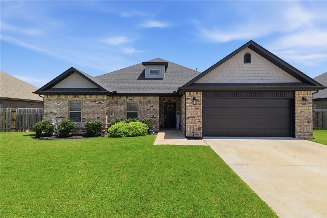 **Seller offering up to $10K in closing credit!** Built by Signature Builders in 2021, this custom all-brick 1,866 SF home offers quality craftsmanship, thoughtful design, and an unbeatable location. The open floor plan features crown molding throughout, engineered wood flooring in the main living areas, tile in wet areas, and carpet in the bedrooms. The eat-in kitchen includes a corner pantry, instant hot water at the sink, and 3 large picture windows that fill the space with natural light. Relax in the spacious living room with a cozy gas fireplace. The 15' x 15' primary suite offers two separate walk-in closets, a jetted tub, and a tiled walk-in shower. Three additional bedrooms provide flexibility for family, guests, or a home office. Enjoy the covered back patio with a ceiling fan and TV hookup, plus a 9-foot-wide double side gate for easy backyard access. Located in a well-maintained neighborhood with a park, within walking distance to schools, and just minutes from Bentonville and the Walmart Home Office.