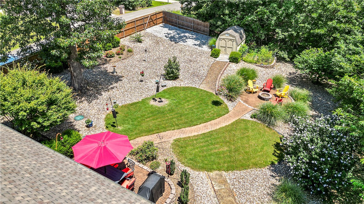 Just minutes from Lake Windsor & Tunnel Vision Bike Trail, this well-maintained 4-bed, brick home has a private thoughtfully designed level backyard oasis with mature trees & plants, covered screened in patio with cedar posts, wood burning firepit & 8x12 ft shed. Located on a corner lot, the cedar & steel post fenced backyard has side access with space to store a boat or trailer. At the heart of the home is the open concept living space with tall ceilings, gas fireplace & new luxury vinyl plank flooring. The kitchen features granite counters, white cabinets, pantry, Bosch induction cooktop, convection oven & a large dining space. The split floor plan offers a large primary suite with dual sink vanity, walk-in tile shower & large walk-in closet on one side of the house and 3 bedrooms with closets on the other side of the house. The 2-car garage has extra storage. For added privacy, the sellers also own the adjacent lot and will give first right offer on it to the buyers of this property. 3-bedroom septic.