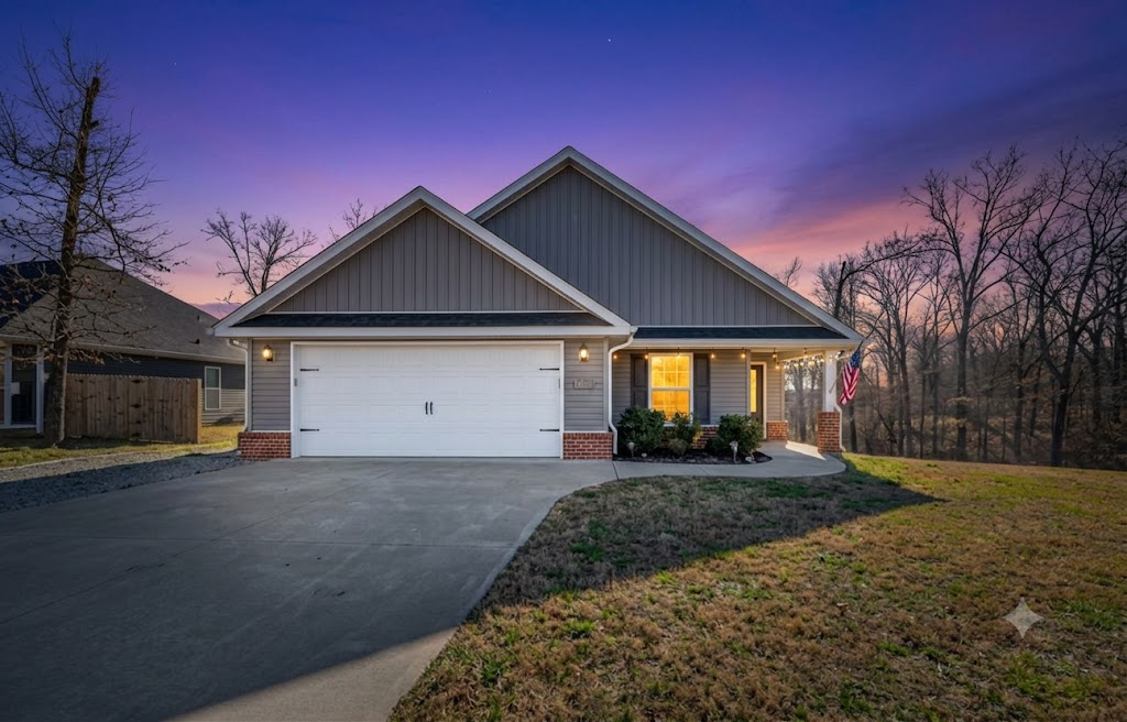 Beautiful, well-maintained home on a cleared lot featuring a desirable split floor plan. Enjoy a cozy gas fireplace and a gas stove, spacious laundry room, and a 2-car garage. Step outside to a lovely deck surrounded by attractive landscaping. Located close to mountain biking and walking trails, the lake, park, golf course, clubhouse, gym, dining and pickleball courts. Convenient interstate access in under 10 minutes makes commuting easy.