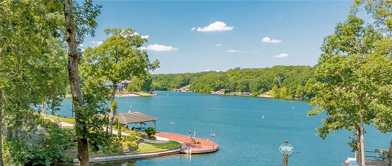 Rare opportunity to own waterfront property on Loch Lomond—Bella Vista’s largest lake! Build your dream home on this beautiful approx. 0.69-acre homesite offering lake frontage, scenic water views, and a peaceful wooded setting. The sloping terrain provides an ideal canvas for creating a home designed to maximize nature's beauty. Located in the desirable Stonehaven subdivision, this property offers the best of both privacy and recreation. Enjoy boating, fishing, kayaking, paddleboarding, or simply relaxing while taking in the tranquil lake views. Community boat access and Bella Vista’s outstanding amenities: golf courses, miles of walking and biking trails, parks, fitness facilities, tennis, pickleball, and more just minutes away. A recent perc test has been completed, making it easier to begin planning your future home. A primary residence or a weekend getaway, this exceptional waterfront property offers an outstanding opportunity to experience the lake lifestyle—all within a short drive of NWA.