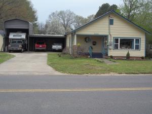 Very close to university of the Ozarks, Large home features 3 bedrooms, 2 baths, open kitchen and dining room, Large 2 room library that could be bedrooms, newly remodeled bath with walk in shower, home has a tremendous amount of storage, outside has covered parking and room for RV, inground storm shelter, workshop area and lots of storage