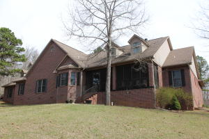 Custom brick home on 29 acres surrounded by National Forest. Over 4400 sq ft with a 4 car garage. 4 bedrooms plus office and den/game room. Safe room could even be used for additional bedroom with its own bath for a total of 4 full baths. Enclosed back sun porch and screened in front porch to enjoy nature and the wildlife. New geothermal heat/air, 2 Marathon water heaters, and central vac. For those stormy nights, no worries with a 15k automatic backup generator. Custom kitchen with double convection ovens and large pantry. Master bath has beautiful clawfoot tub and walk in shower.  Storage shed and 14x14 utility/well house. Large laundry/craft room. Lopi wood burning fireplace insert. Speakers wired in every room. Country living at its best without sacrificing quality!