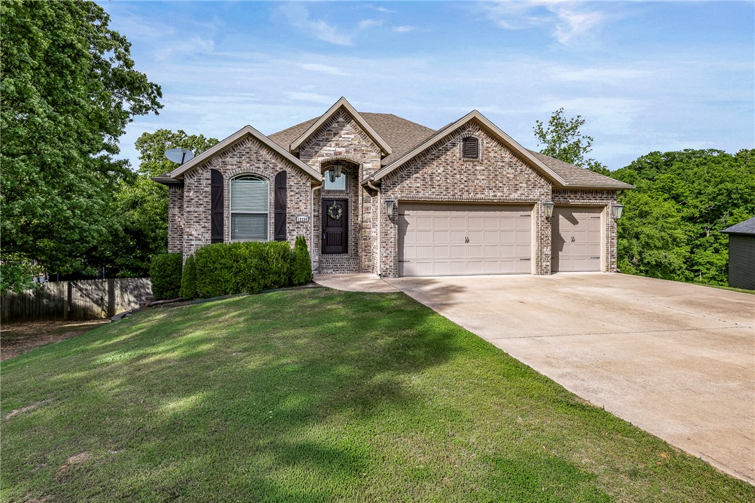 Tucked away at the end of a quiet cul-de-sac, this home sits on a peaceful 1-acre lot surrounded by mature trees, offering privacy and a serene natural setting. The floor plan features 2 spacious living areas, allowing for a variety of lifestyles—whether you need up to five bedrooms or prefer dedicated spaces for a home office, gym, or hobby room. The kitchen is built for gathering, with an oversized island that seats six, along with double ovens for entertaining. A hidden walk-in pantry is tucked behind cabinet doors, adding both charm and function. A unique highlight is the versatile workshop, accessible from outside or through a closet with a “secret” interior door—perfect for projects, storage, or creative pursuits. The walk-out basement opens to a double-level deck & patio, ideal for enjoying sunrises & overlooking the expansive backyard. Outside, you’ll also find a quaint treehouse nestled among the trees. New Roof being installed June 2026!