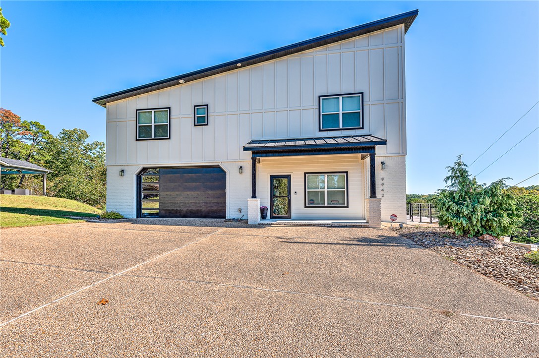 This is a one of a kind lake house. The home has all year around lake views at almost all widows and decks. 3 bedroom 2 bath with  a set up bunk beds plenty of room for more sleeping areas not counted in bedrooms. We  have  3 deck areas the lower one is setup and wired for hot tub.  The house features a 12x30 community slip with a 8800lb lift 2 years old. The house is 5 years old. We remodeled  90 percent of the property from its original building taken down to the slab.  The primary bedroom features a King bed. The second bedroom has a king bed. The third bedroom has a queen bed. The bunk bed is in the second living area downstairs. We have a boat ramp in the neighborhood.  Holiday Hills Neighborhood we do Neighborhood fireworks on  4Th great neighbors.  oversized garage, agent owned. We have a 45 ft driveway beside the house  for extra  camper/boat  storage or daily use.   could be covered for all around  year use. no covenants against doing this what so ever.