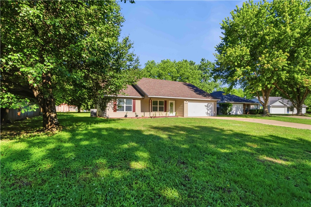 Welcome home to this well-maintained, one-owner gem.  This inviting 3-bedroom, 2-bath home with a 2-car garage features a desirable split floor plan designed for comfort and privacy.
The spacious eat-in kitchen includes a pantry, ample cabinetry, and plenty of storage throughout the home. The primary suite offers two closets and a private bath with double sinks for added convenience. Major updates include a new roof in December 2025 and heater replaced in 2019.
Situated on a large lot with adjoining farmland to back of the property, this home is just a short 7-minute drive to Lake Sequoyah and the Elkins Sports Complex, with shopping, restaurants, and everyday conveniences nearby. Start your mornings with a cup of coffee on the covered front porch while watching the sunrise and unwind in the evenings with breathtaking sunset views that make this property truly feel like home.  If you're looking for a place to call HOME this is the one.