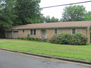 Beautiful and affordable West Russellville home in a great established neighborhood with a cozy fireplace, wood floors, pretty updated bathrooms, and a nice back deck!