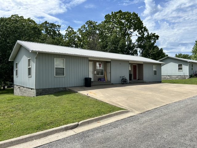 Unique income-producing opportunity! This property offers incredible flexibility—live in one unit and rent the other to offset your mortgage, or add a turnkey asset to your investment portfolio. Each unit features 2 bedrooms, 1 bathroom, and a full kitchen with appliances included. Unit B was fully remodeled in 2024. Both units are currently occupied, and the metal roof and siding provide low-maintenance, worry-free ownership. No interior photos are available due to tenant occupancy; photos of similar units can be provided upon request.