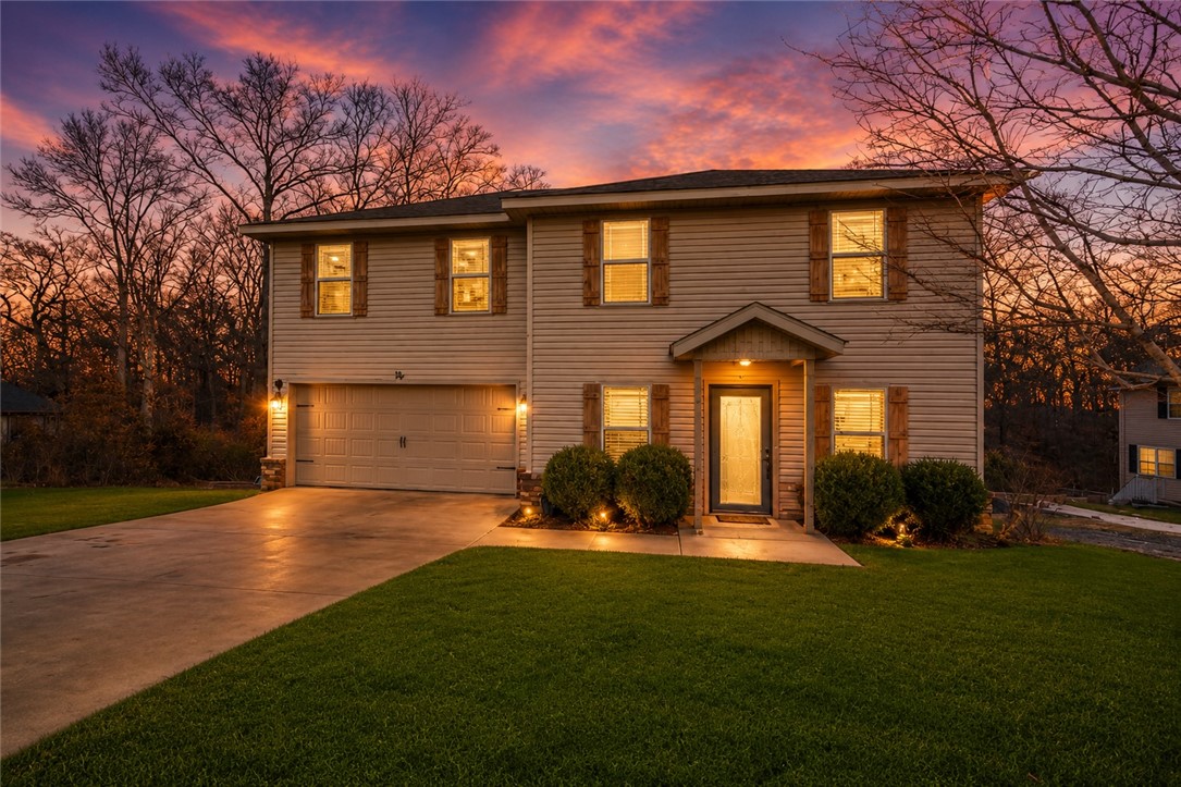 Where else in Bella Vista can you find a home close to the trails and everything Bella Vista has to offer for under $300,000, 75 Melanie is the perfect Bella Vista home.Enjoy quick access to Blowing Springs Park, the Back 40 Trail System, and the upcoming Oz Bike Park and bike lift.Inside you will find 3 bedrooms, 2.5 bathrooms with new vinyl flooring downstairs and stylish lighting.The open living area leads to an eat-in kitchen featuring granite countertops, stainless steel appliances and a spacious walk-in pantry. Primary suite offers two large closet, a private bathroom with a double vanity. Upstairs landing area includes a built-in desk and storage, perfect for a home office, plus a laundry room convenient to all bedrooms. Step outside to a partially fenced, wooded yard and a covered deck off the dining area, perfect for entertaining. Experience Bella Vista's lifestyle with 7 lakes, 100+ miles of bike trails, mountain biking, kayaking, fishing, and golf all nearby. 75 Melanie is waiting for you!