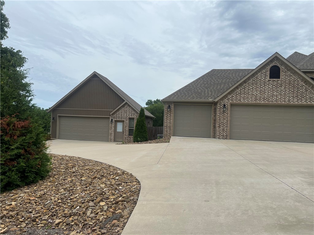 Rare Find Custom Built home with Amazing Amenities on FOUR! (4)!  Level Lots!  Partial Lakeview from Primary Bedroom, Upper & Lower Decks.
Four Bedrooms (3 downstairs) (1 upstairs) can also be an office.  Great Room upstairs with huge Storage Closet, Access to Attic doors upstairs, Large Rooms, Plantation Blinds throughout, Quartz Countertops, Custom tile & backsplash,Steam Shower in Primary Shower, Propane Fireplace, abundant closet spaces.  Screened in Patio/deck off Breakfast Area.  Loch Lomand 4th of July Fireworks can be seen from backyard, which is 4 level lots.  
Homeowners are licensed Real Estate Brokers in AR.