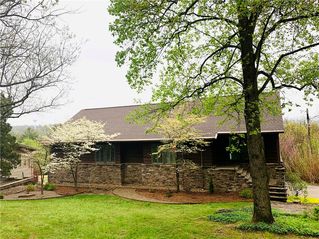 Check out this RARE find and amazing 4,045 square foot home in Fayetteville!  If you are looking for a large home full of tasteful upgrades such as New wood floors, New HVAC, New deck, Roof replacement in 2018, along with multiple other remodels, this is the home for you! One of the home’s most special features is the view of the mountains and so much of Fayetteville! Picture yourself sitting out on your private back deck, enjoying your very own hammock park set up, grilling, bird-watching,  and embracing Mt. Sequoyah’s beauty! This home is near Root Elementary, Mt. Sequoyah trails, Mt. Sequoyah Center, 8 minutes to the trailhead to bike and hike, as well as in a quiet neighborhood with one of the rare full mountain and tree line views off the deck. You will love the finished basement that can be used as a second living/ game/movie area/wet bar area, an investment rental with its’ own exterior entrance, or simply for extra bedroom and bonus space! Don’t’ miss this park-like estate home and large lot!