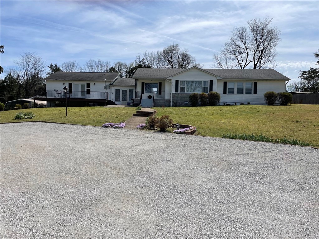 Well maintained 2414 sq. foot Home in side the City limits. Hard wood floors through out most of the House along with a High end Laminate in the Great room. The Great room features a vaulted ceiling along with a Electric Fireplace. # bedrooms and 2.5 Baths. Bright Kitchen connects with a Dining area. Downstairs is a walk out Garage that is also a storm shelter area. Fenced in back yard for your kids to play in along with an extra block building for storage. Extra carport is located on the paved part of the driveway. Not much traffic on this Circle Dr. Motivated seller. Willing to negotiate.