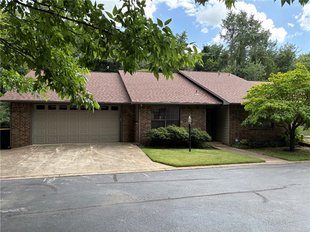 One of the largest condos in White Oak Station features a beamed cathedral ceiling in the huge living room, a family room with stone floor and stone gas log fireplace, large primary bedroom with beamed cathedral ceiling, 2 walk in closets and primary bath featuring handicapped accessible walk in tub + shower unit and vanity with double sinks.  The kitchen affords ample cabinets, counter space and a pantry that will accommodate your meal preparation needs. Walk in from the garage without any stairs and enjoy the easy access and living on one level.  Secluded end of street setting. Convenient location facilitates being most places in Harrison in 10 minutes or less!  Harrison, the Hub of the Ozarks is within an easy hour or less of Branson, MO, Bull Shoals and Table Rock lakes, The White, Buffalo and Kings Rivers and numerous hiking, swimming, boating, kayaking/canoeing, fishing, camping, hunting and sightseeing venues. Let the association take care of the grounds and use your time to enjoy the Ozarks from here!