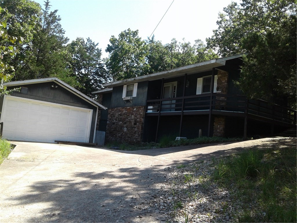 Come take a look at this home it is priced to sell fast.  3 bedrooms 2 bath great deck areas to entertain or just sit and relax stone fireplace in family room.  Wooded lot but close to all the amities of the Island. Large garage and concrete driveway