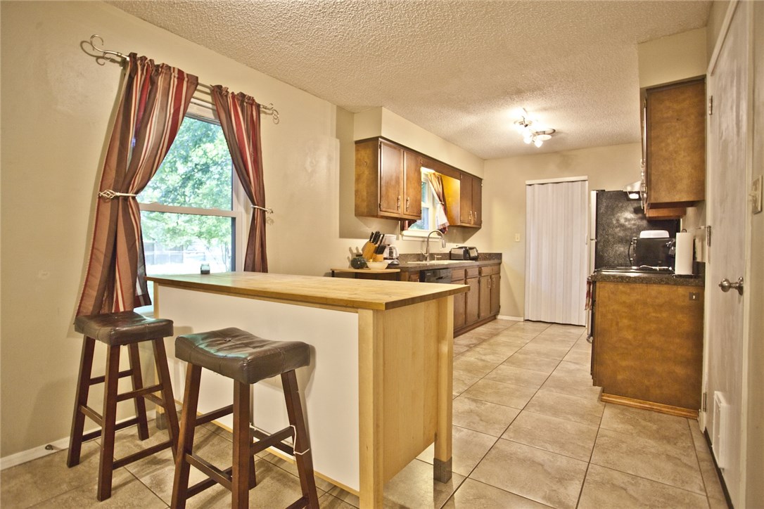 Move in ready 3 bedroom 2 full bath home with converted 2 car garage that can be used as additional living or a bedroom. Check out this clean home with huge back yard 2 storage sheds that convey and a screened in porch. Conveniently located off the bypass minutes to everything. Great home to buy while kids go to college and rent out all the rooms to cover the mortgage or perfect for a family!