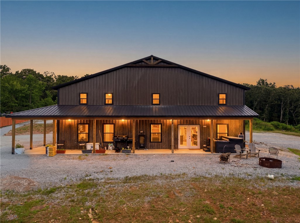 One-of-a-kind barndominium offering the perfect blend of luxury living and exceptional workspace! This 50x80x16 insulated shop house features approximately 5,000 sq. ft., including 3,000 sq. ft. of shop space and 2,000 sq. ft. of finished living space with two separate apartments, making it ideal for multi-generational living, rental income, guests, or a home-based business. Built with 2x6 exterior walls and spray foam insulation for year-round efficiency. The shop is equipped with five 12'x14' overhead doors, providing easy access for RVs, equipment, or large vehicles. Property offers 400-amp electric service (200 amps to the shop and 200 amps to a separate upper building site), complete with water and utilities already in place for a future pool house or additional home. All gas and electric utilities. A rare opportunity to own a versatile, high-quality property with endless possibilities!