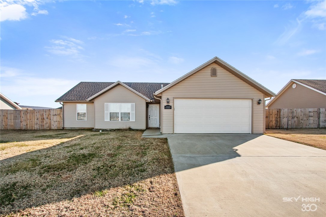 Minutes from Historic Downtown Prairie Grove and the Battlefields, this home is 1 of only a few homes still available in this quiet subdivision. Home sits on well maintained, flat, lot with full privacy fence backyard. Living space flooring is wood laminate with carpet in the bedrooms and tile in bathrooms. Garage offers room for parking and storage. Kitchen and living room offer plenty of space with open flow layout. This could be an amazing investment opportunity or make someone a great primary residence. Sellers are motivated and willing to negotiate. Bring us an offer!