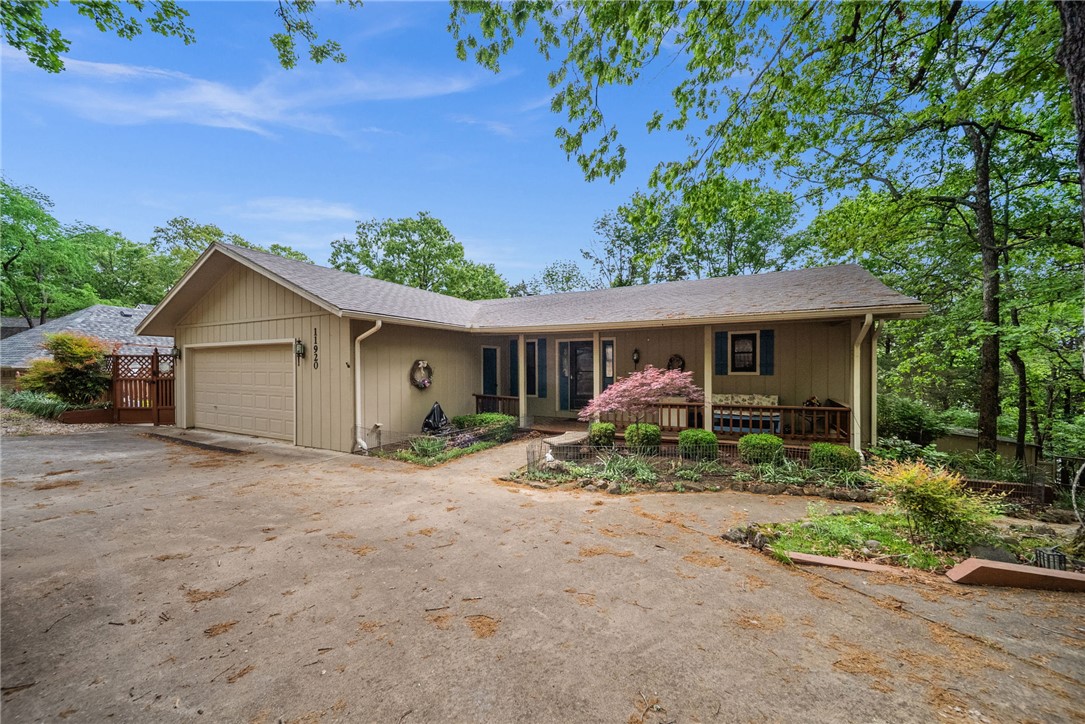 Motivated Seller!!! Experience the best of lake living in this beautifully maintained 3 bedroom, 2.5 bath lakefront home in Lost Bridge Village.  This inviting property features a 2 car garage plus a 1 car detached garage.  Enjoy outdoor living at its finest with two levels of spacious decking overlooking the natural surroundings, along with a charming gazebo ideal for entertaining.  

The home is surrounded by extensive landscaping and thoughtfully designed raised bed gardens, creating a peaceful, park like setting.  A gentle, easy walk leads you straight to the lake.  Inside and out, this home has been exceptionally well cared for, offering a move-in ready retreat.  

Located in a desirable community with amenities including a pool and pickleball court, this property combines comfort, convenience, and the ultimate lakefront lifestyle.   Whether you are looking for a full time residence or weekend escape, this Beaver Lake gem delivers!