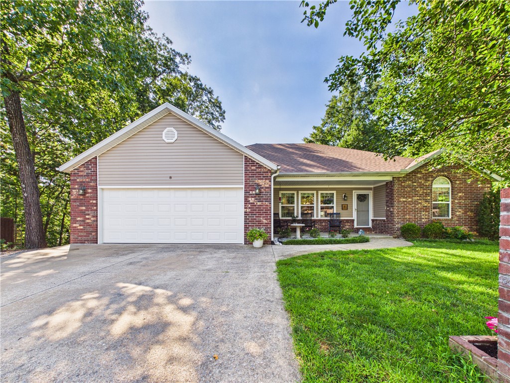 Three lots!!!!! Beautiful home with 3 beds and 2 full baths. Large room sizes and well maintained. New flooring in living area and brand new carpet in the bedrooms.  This home is on sewer and includes 2 extra lots that also have sewer available.  Large garage, RV hook ups, fire pit, and privacy fence. Beautiful hickory cabinets and tons of storage make this home unique.  There are 2 storage areas under the home for bikes, an office, or a place to start your seedlings in the spring!  New Roof in 2019, new windows in front in 2021, new water heater in 2025.