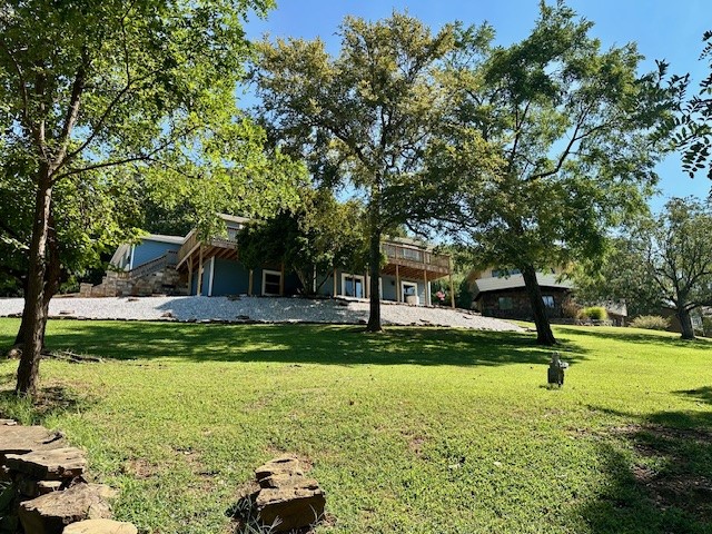 Don’t miss your chance to own a beautiful home in East Fayetteville. Located in the prestigious Hyland Park Subdivision, 2841 Hyland Park Avenue boasts stunning hill-top views of Fayetteville and surrounding natural beauty from a wrap-around deck! Space is not an issue in this large home which features 4 bedrooms and 2.5 bathrooms. The kitchen was recently updated with modern appliances and new backsplash! This one of a kind home has 2 living rooms with fireplaces, an office, and a formal dining room great for hosting guests!  In addition to the 2nd living room, downstairs offers a kitchenette for added convenience. Exit the lower level to a new patio covered by the above wrap around deck. Fayetteville schools, local shopping, Dickson Street, and downtown Fayetteville are all within close proximity to this breath-taking home. Schedule you’re showing today to view this spectacular home.