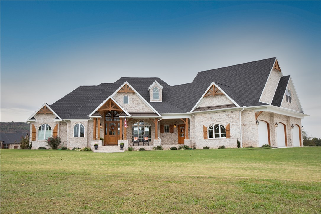 This spectacular property exudes beauty, elegance, and taste throughout! This stunning brick home and shop sits on 5 acres with outstanding views in every direction. There are 3,651 SF of heated/cooled living space in the house plus 638 SF of carpeted and finished living space in the detached garage/shop, totaling 4,289 of prime living quarters to enjoy! The house is extremely appealing inside and out with great color choices and finishes. It also has a safe room with one-foot thick, reinforced concrete block walls and a 25KW propane full house power generator. Epoxy garage floors. You must see this one to appreciate!