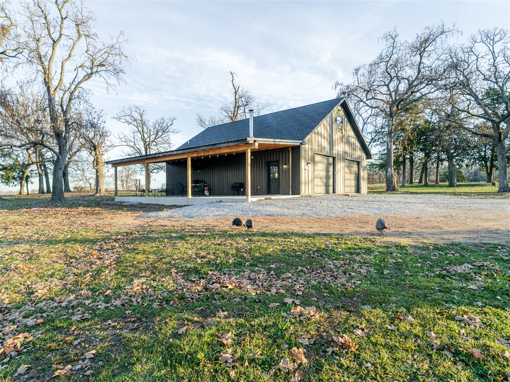Escape to the country w/this 8 acre property offering wide-open space, gorgeous views, & endless potential. At the heart of the property is a 2,025 sq. ft. shop w/a 1 bed1bath living space,& currently being used as a home w/kitchen & open living space. This versatile building can remain as a home, or it can be a shop w/living quarters. Additional features include rural water, an RV hookup, & a large old barn that adds character & storage options, w/potential for restoration. This property is truly unique offering privacy, quiet country living,& flexibility for a variety of uses.