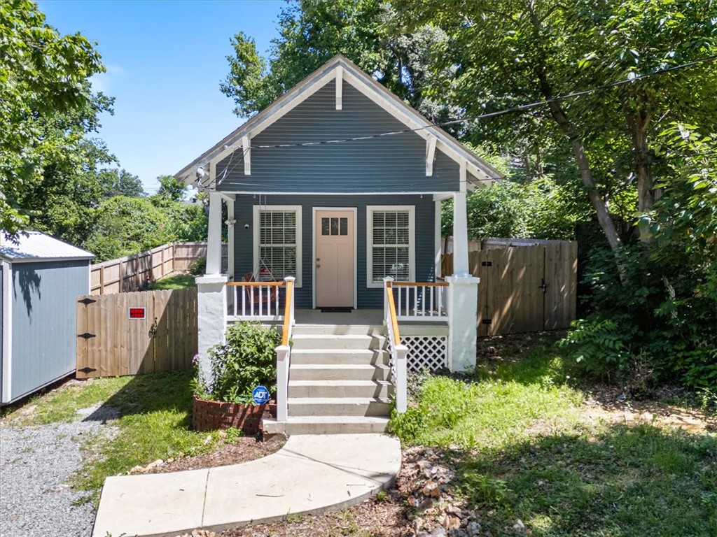 **Charming Downtown Siloam Springs Home!** Nestled in the heart of downtown Siloam Springs, this quaint and inviting home offers the perfect blend of character, convenience, and comfort. Enjoy being just minutes from local parks, walking trails, shopping, dining, and John Brown University, making this an ideal location for homeowners and investors alike. Over the years, numerous improvements have been made, including updated windows, flooring, insulation, central heat and air, roof, and porch, providing peace of mind while maintaining the home's timeless appeal. Whether you're looking for your first home, a rental opportunity, or a charming place to enjoy all that Siloam Springs has to offer, this property is a must-see! Nearby access to parks and the Dogwood Springs Trail adds to the home's appeal for outdoor enthusiasts.