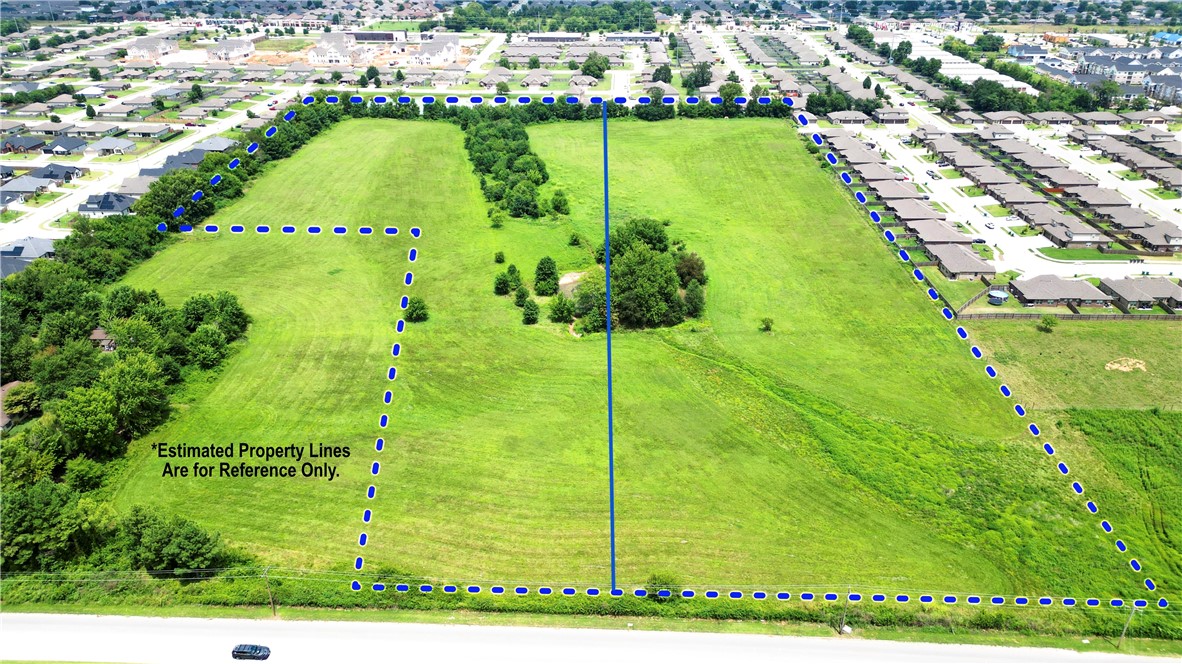 Expansive 11.09 acres cleared land with some flood plain. Located in a rapidly developing area, this property is surrounded by evolving residential and commercial developments. This open land provides endless possibilities for development and is waiting for your creative touch. An additional 11.09 adjoining acres from a separate seller is available for purchase MLS 1282225.  The property has undergone a recent survey, ensuring accurate and up-to-date information.  Property lines are marked as reference only.