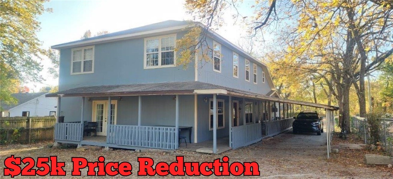 Back on the market at no fault to the Seller.  Looking for a home with an attached in-law apartment that could be used for additional income? Look no further. This 5-bedroom 4 bath home in the Bentonville School district boasts 3 living spaces. The main residence features an open concept kitchen, dining, and living room with gas fireplace plus primary suite on the lower level. Walk out of the primary bedroom to a covered deck that wraps around the home. The upper level features an additional living room, 2 bedrooms, a bathroom, and a bonus room, perfect for a home office or gym! The attached in-law unit has its own private entrance but can also be accessed directly from the primary home. This 2-bedroom, 2 bath apartment features its own kitchen, living room, laundry room, primary bedroom with ensuite, second bedroom, and a full bath. Entire property is fenced. Backyard features a firepit and new 8x12 storage building. Property can be easily rezoned for commercial purposes.