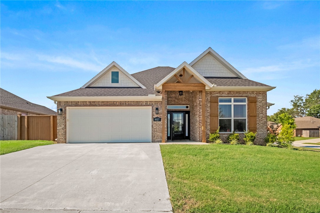 Absolutely gorgeous all brick home sitting on a manucured corner lot. As you open your new front door you're greeted by fresh modern, bright colors throughout.  The light wood floors with the entire back wall of windows cascading natural light throughout the home gives you the feel of being at the beach. As you enter you will be greetd by a large living room with tall ceilings and a floor to ceiling brick corner fireplace. The open floor plan leads to a completely white washed kitchen that you will make you want to cook at home! The huge island with storage under the white granite top is the perfect place for family and friends to gather. Stainless appliances and lots of cabinets allow plenty of space for everything. The primary bedroom has wood beamed cathedral ceilings with ensuite featuring dual vanities, tiled shower, Jacuzzi and walk-in closet. Two more good sized bedrooms perfect for the kids. Private laundry room keeps your mess hidden away. Covered back porch and fenced backyard keep dogs and kids safe.